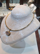 Necklace in 14k gold with a seal stone on a chalcedony