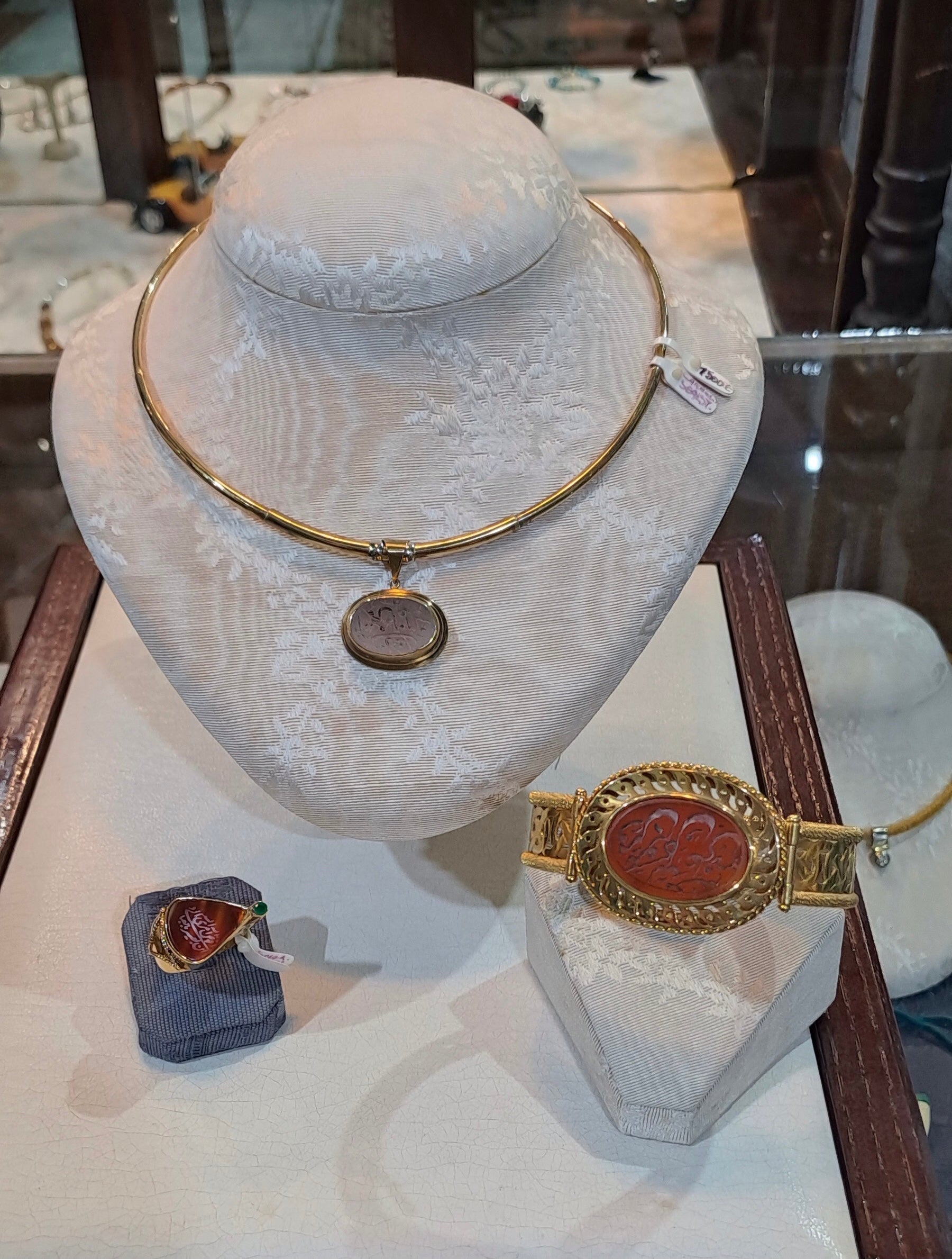 Necklace in 14k gold with a seal stone on a chalcedony