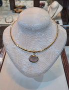 Necklace in 14k gold with a seal stone on a chalcedony