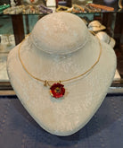 Necklace in 18k gold and a flower pendant with enamel