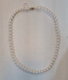 Necklace in white Aqua pearls with 18k gold closure