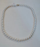 Necklace in white Aqua pearls with 18k gold closure