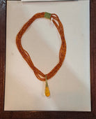 Necklace with Amber and medallion with brilliant in gold 18k