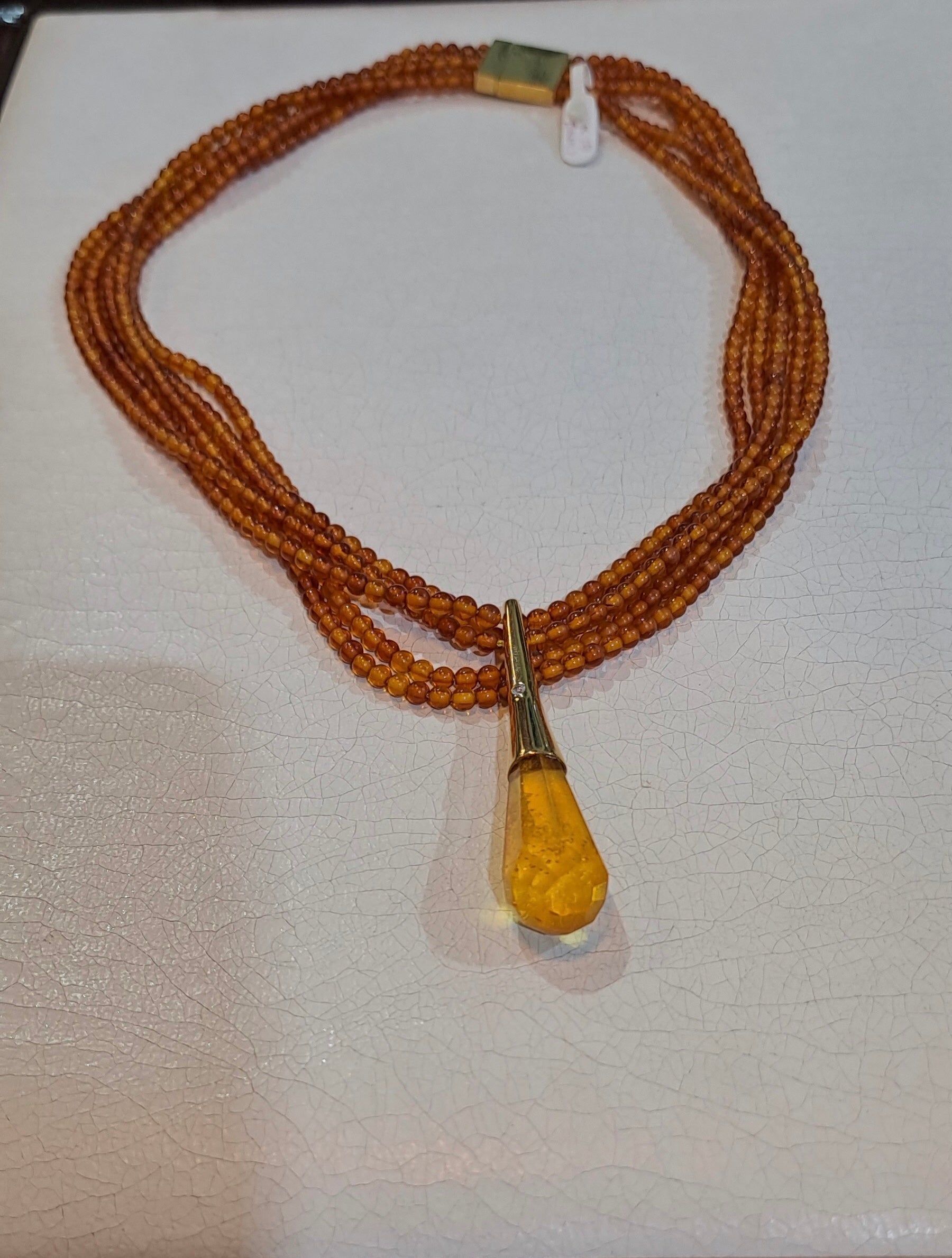 Necklace with Amber and medallion with brilliant in gold 18k