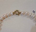 Necklace with white pearls and 18k gold closure