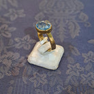 Ring in 14k gold with a blue topaz