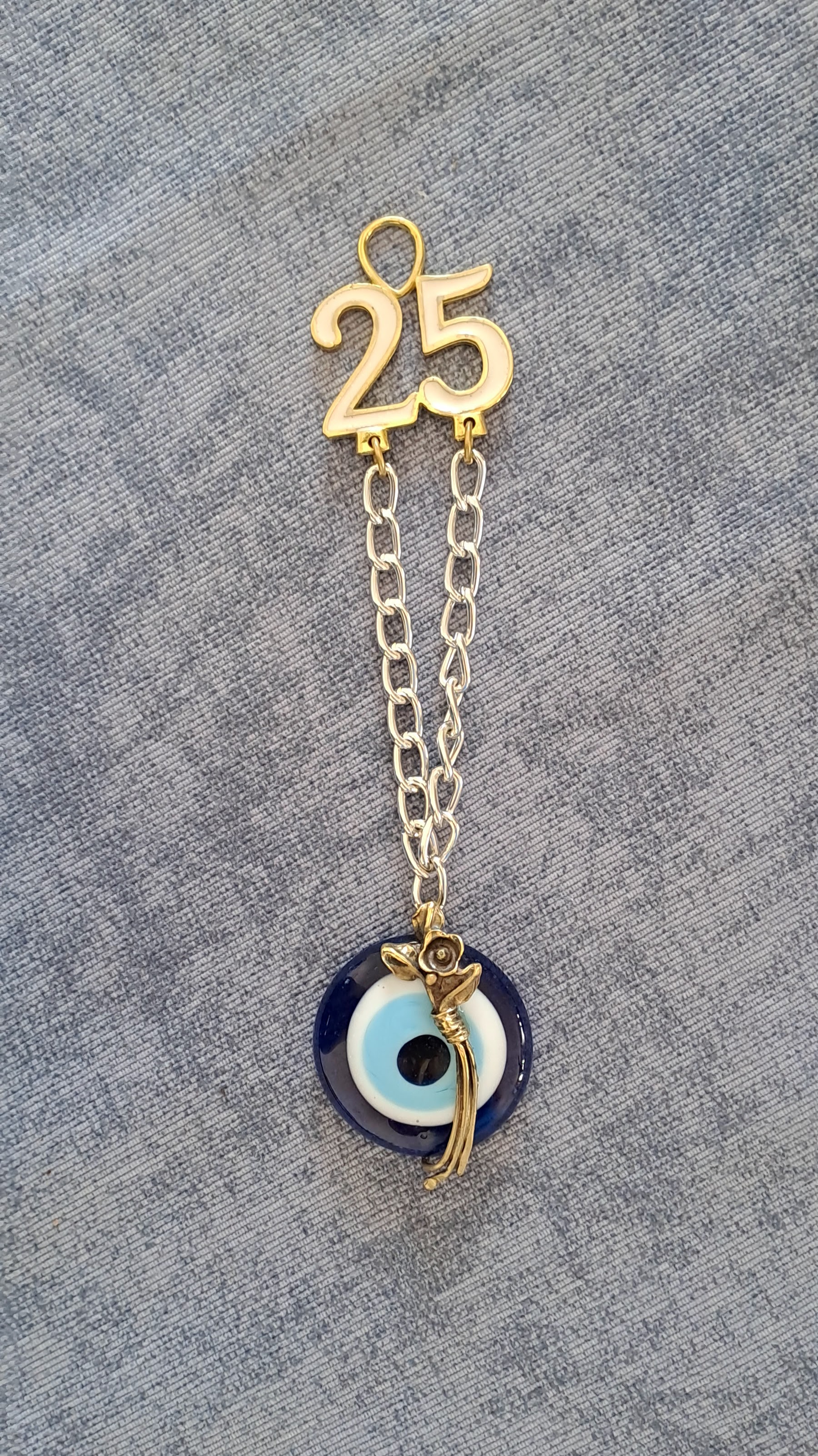 Sterling silver charm on Plexiglas - Evil Eye Charm