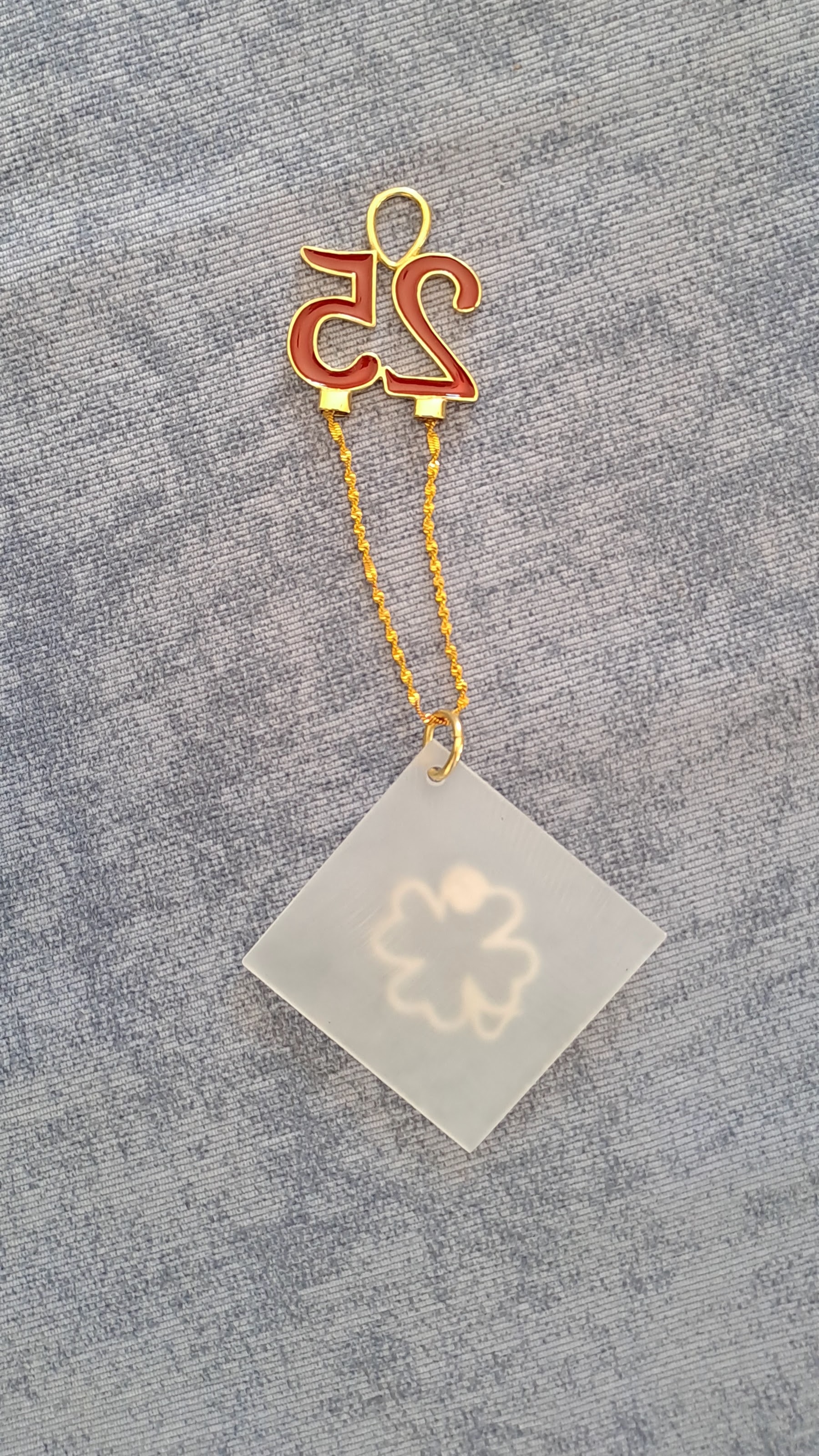 Sterling silver charm on plexiglass - Four Leaf clover