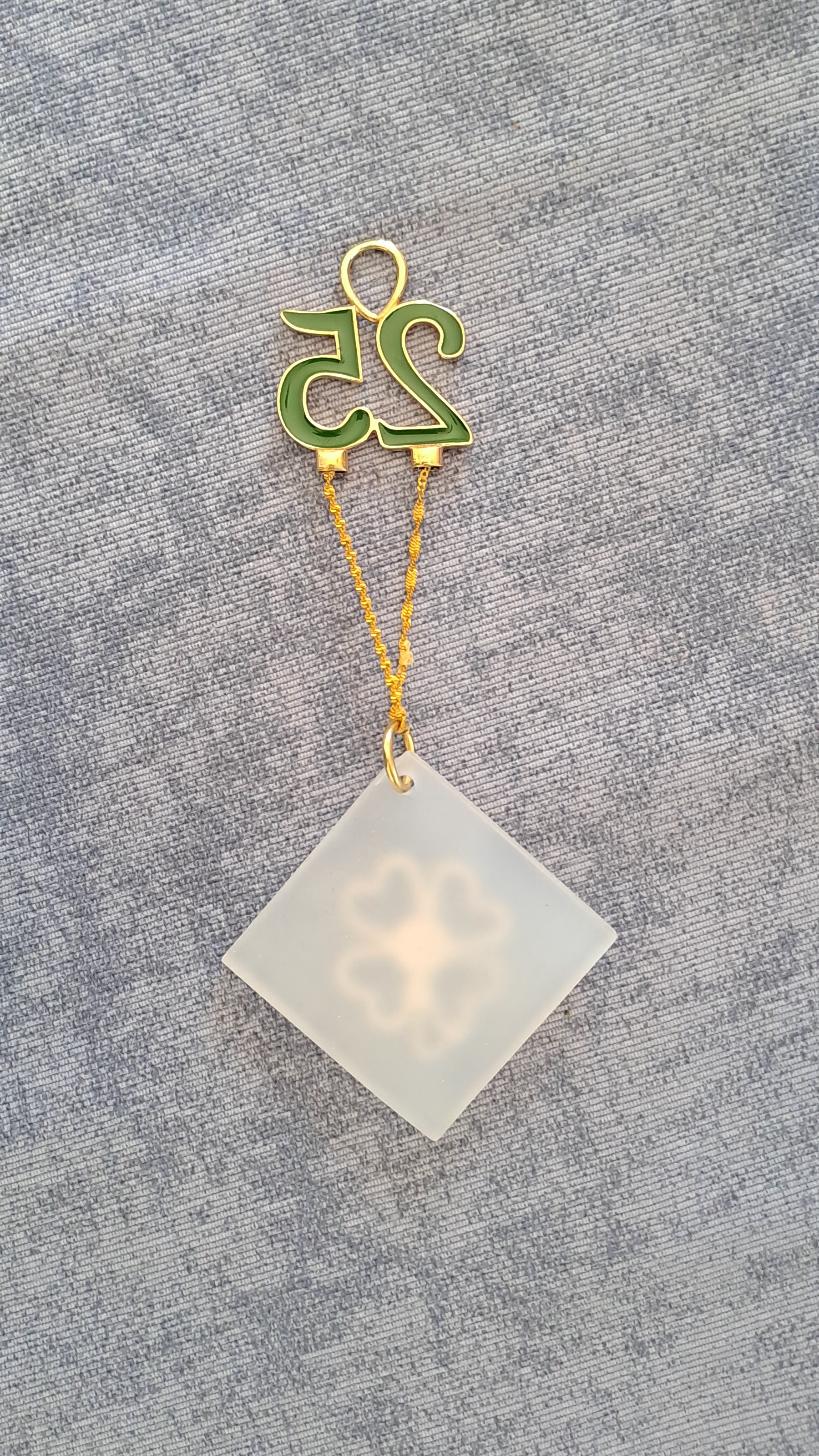 Sterling silver charm on plexiglass - Four Leaf clover