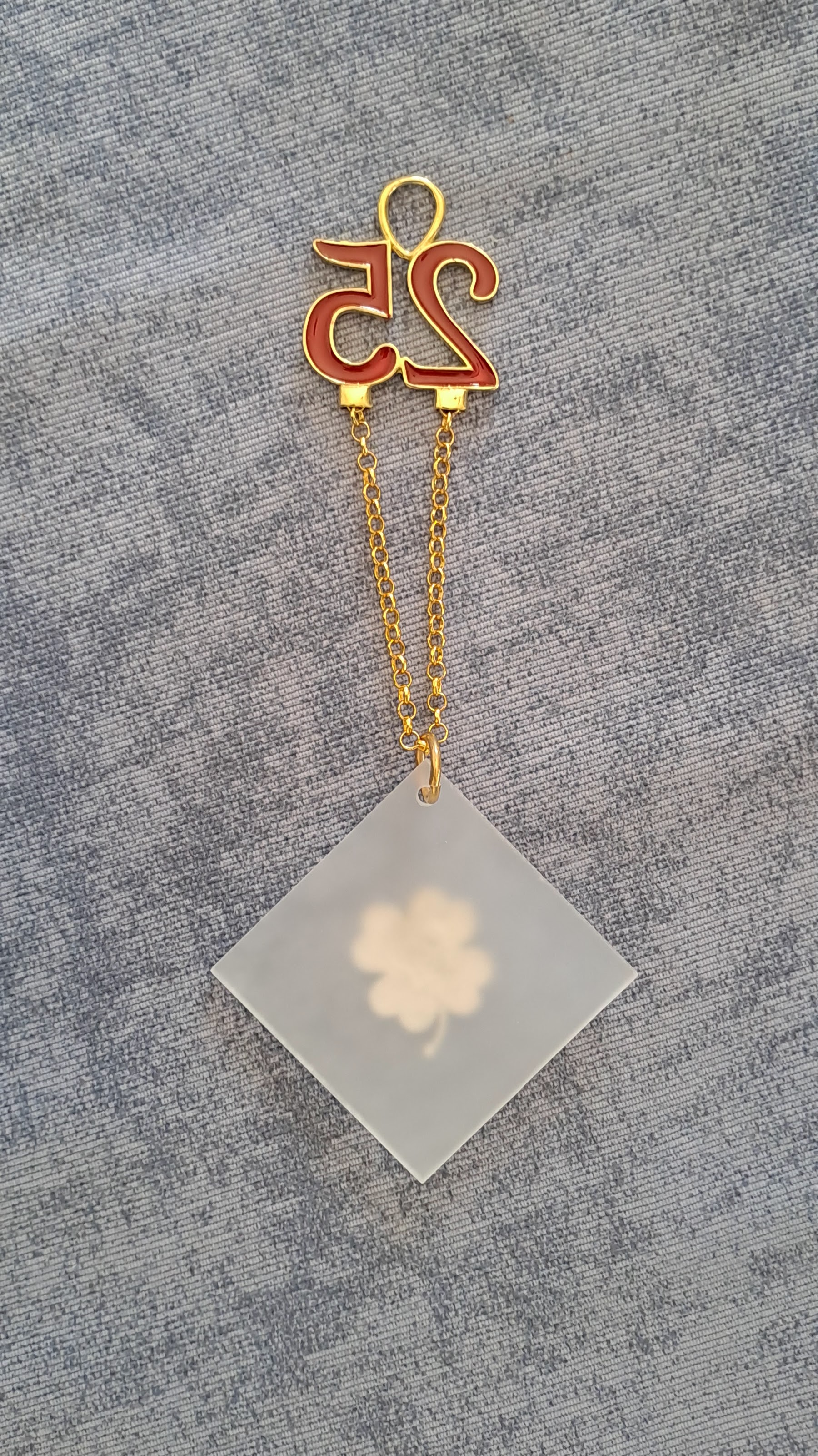 Sterling silver charm on plexiglass - Four Leaf clover