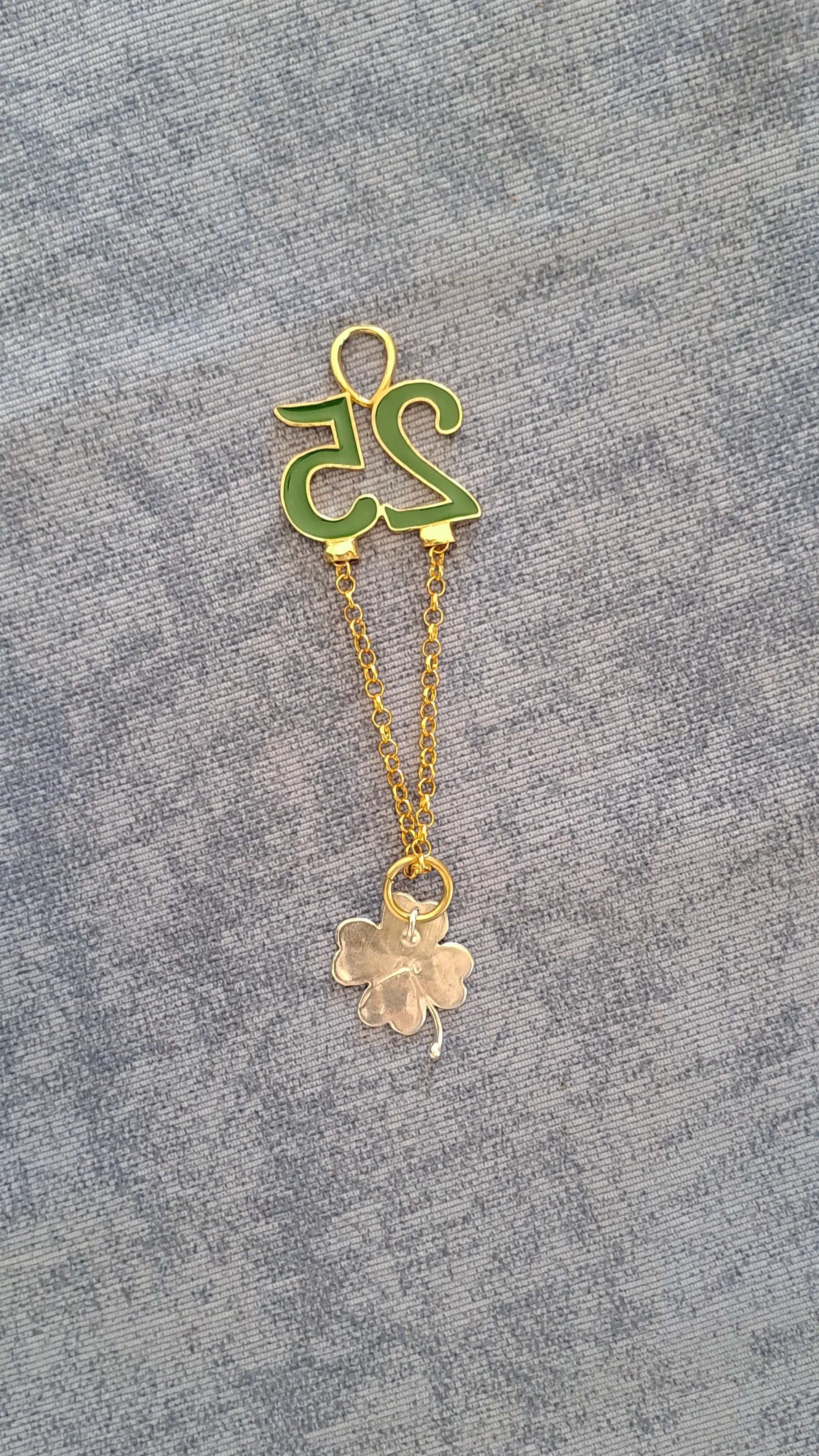 Sterling silver charm on plexiglass - Four Leaf clover