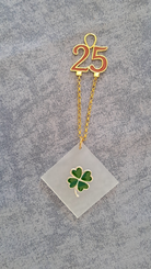 Sterling silver charm on plexiglass - Four Leaf clover